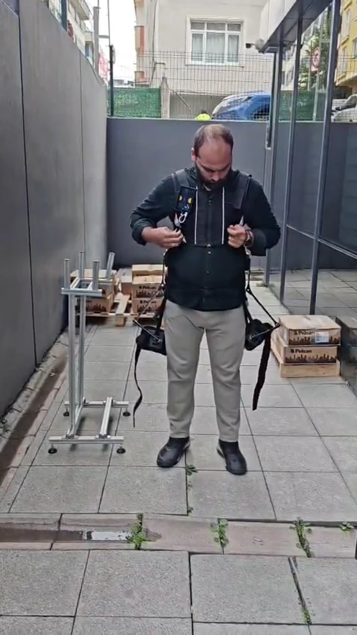 User adjusting the front straps of the V-UP prototype outdoors