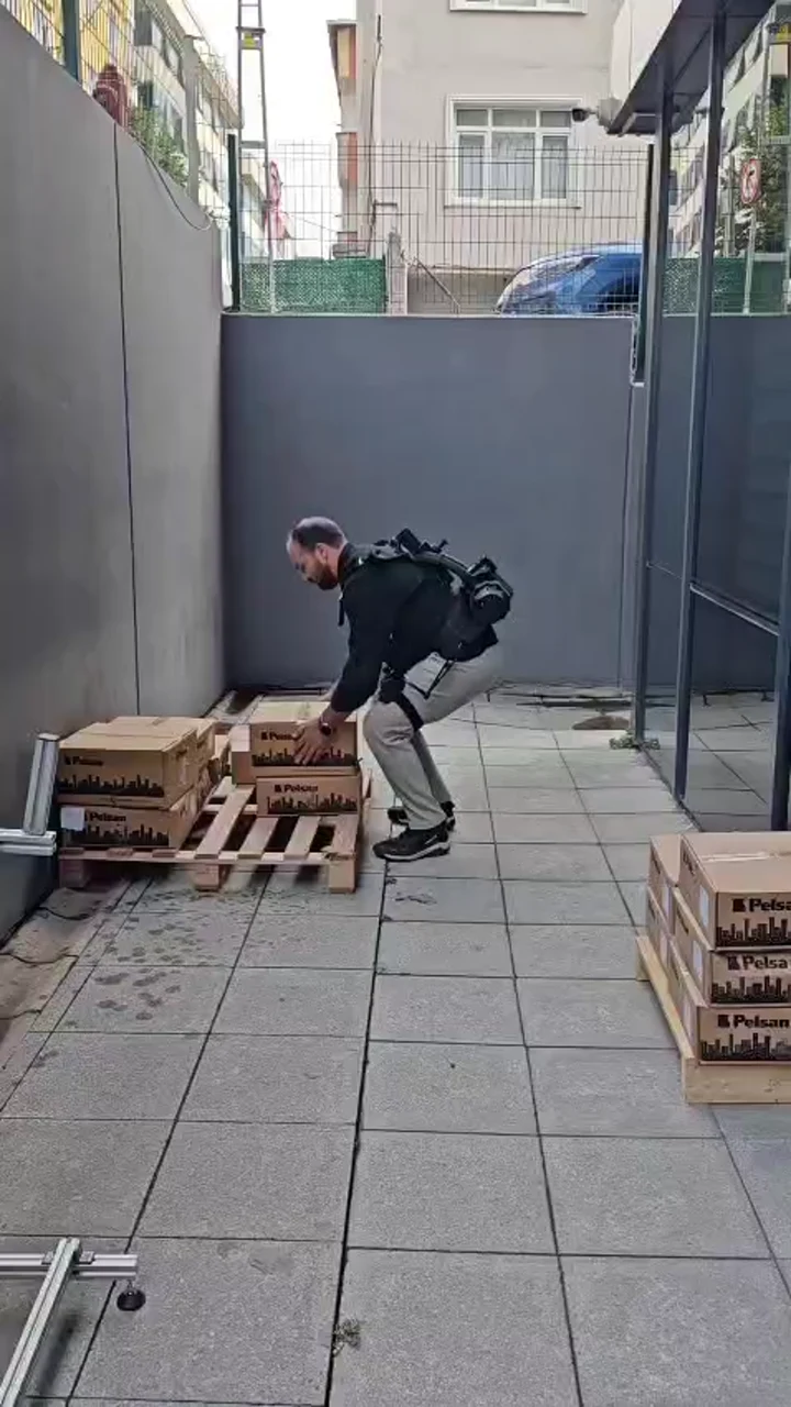 V-UP prototype user bending towards a pallet during testing