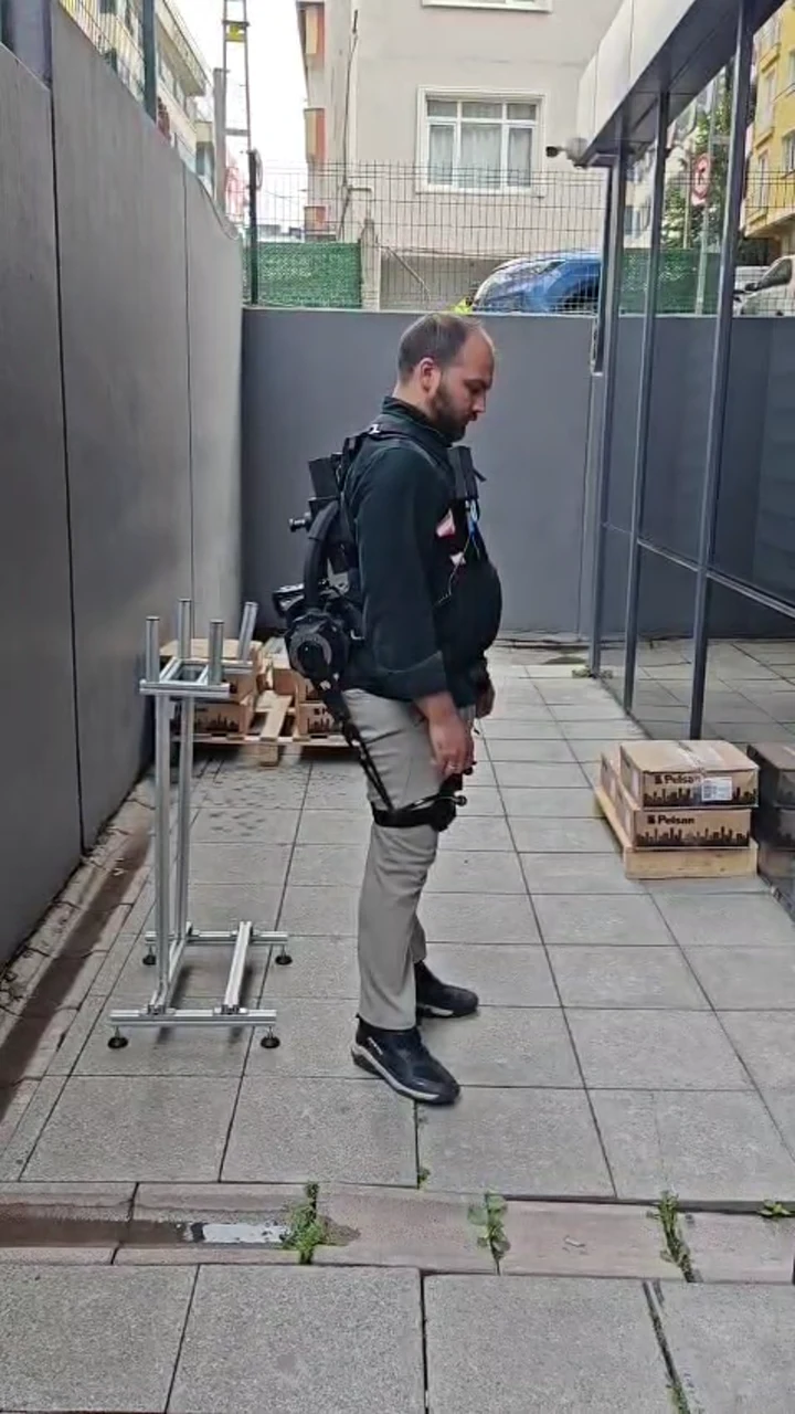 Side view of a user wearing the V-UP prototype during outdoor testing